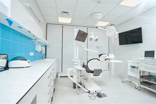 An empty dental office with equipment