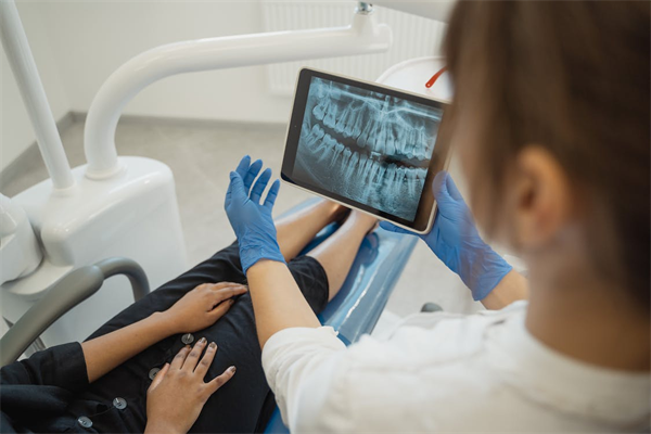 A dentist showing a dental X-ray