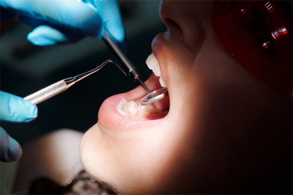 A person getting treated by a dentist